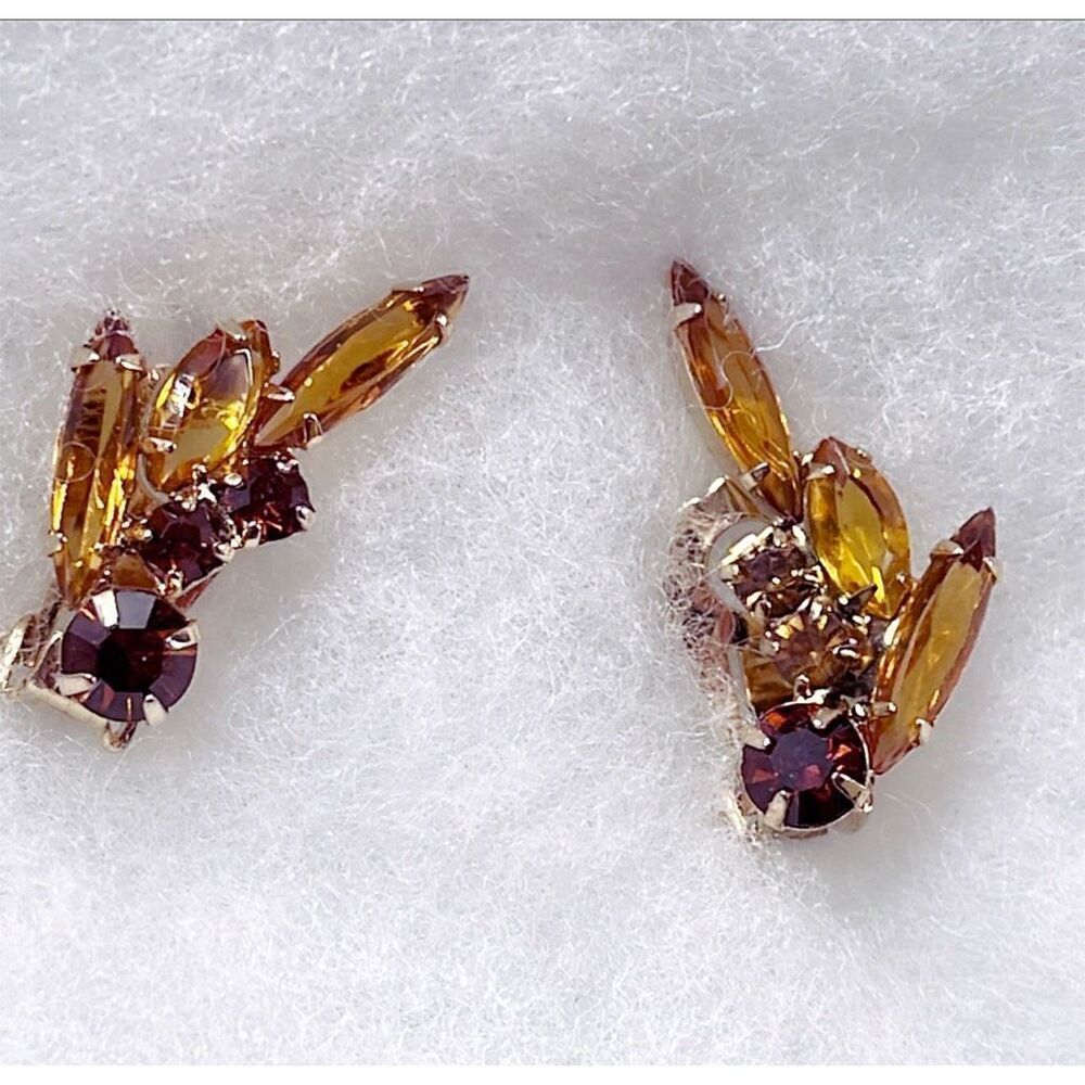 Vintage amber colored glass climber earrings.